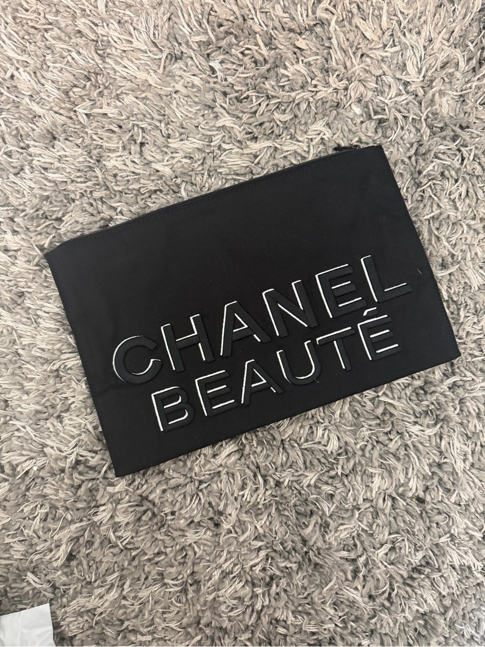CHANEL Black Embossed Beautรฉ Cosmetic Pouch